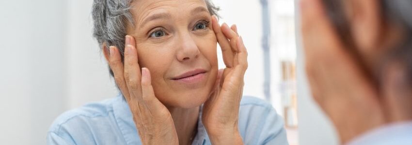 a woman checking her face after a nad infusion