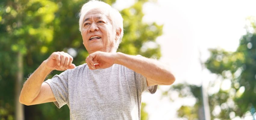 The aged man is happy while exercising after taking the nad+ supplements.