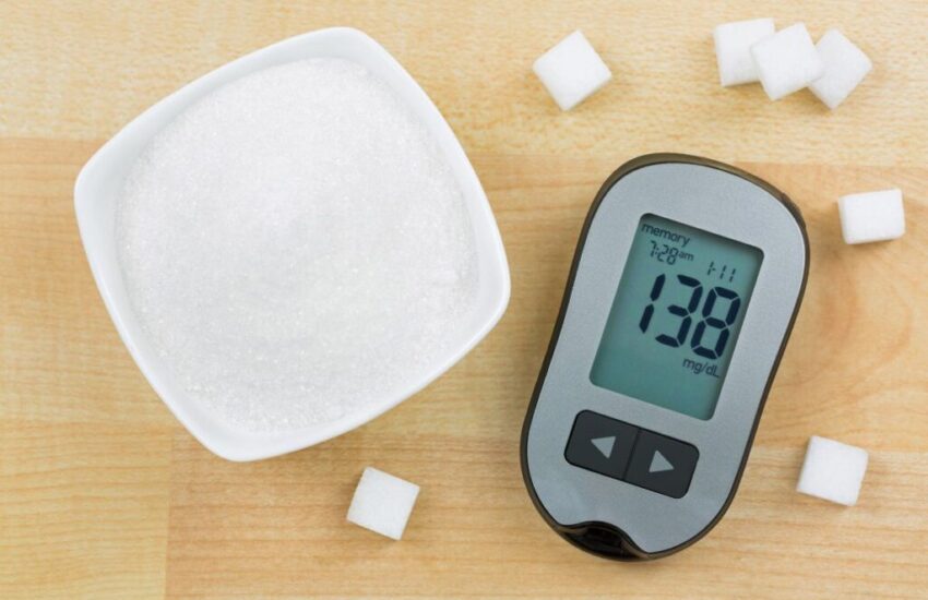 A bowl of sugar and equipment to check the blood sugar level.